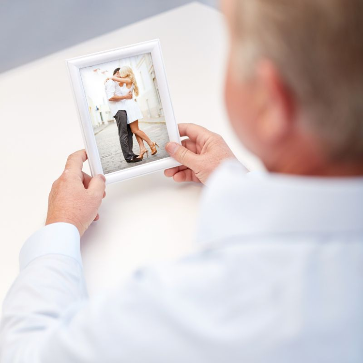 Elderly couple cherishing a personalized memory book album